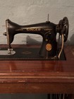 Vintage Foot Pedal Sewing Machine And A Vary Collection Of Buttons   