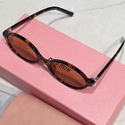 Miu Miu Women   s 04zs Oval Sunglasses Brown Frame   Tinted Brown Lenses Plastic