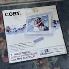 Coby Dp-769 7  Widescreen Digital Photo Frame With Mp3 Playback In Box