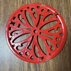 Flower Footed Trivet Crafted From Enameled Cast Iron Cherry Red