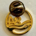 1984 New Orleans Worlds Fair Official Logo Lapel Pin stylized Mississippi Delta