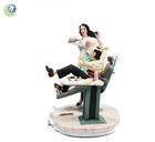 Decorative Figurine Statue Of Female Brunette Dentist Performing An Extraction 