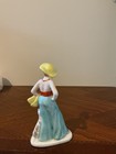 Vintage Art Deco Porcelain Figurine Depicting A Stylish Woman In A Wide-brimmed 