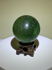 Fluorescent Polished Green Fluorite Sphere W  Wooden Stand - 1 8 Inches