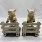 A Pair Of Hand Painted Cast Iron Pig Jumping Over A Fence Book Ends