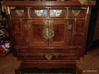 Antique Asian Wooden Cabinet With Ornate Brass Hardware And Four Drawers