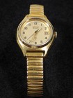 Vintage Seiko Gold Tone Date Indicator Round Case Stainless Stretch Watch