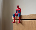 Spiderman Seated Cloak Statue Figurine  Sitting On A Shelf