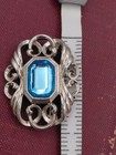 Vintage Avon Silver Tone Blue Gem Emerald Cut Filigree Lapel Pin Brooch 1989
