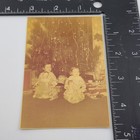 Smiling Girls Christmas Tree Holding Toy Dolls Holiday 1940s Vintage Photo