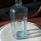 Blue Ribbed Glass Bottle W  Embossed Design  Hex Base Marked 2 50