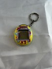 Tamagotchi Connection V2 Yellow With Yellow   Teal Flowers 2004 Virtual Pet