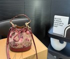 Coach Bucket Bag With Cherry Print  A Stylish And Playful Choice