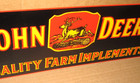 John Deer -- Quality Farm Implements -- Deere Stepping Over Tree --- Black  Sign