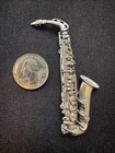 Vintage Silver Pewter Saxophone Brooch Pin By Jj  jonette Jewelry Company 
