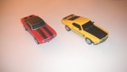 2- Collectible 1 32 Scale Slot Cars 1- Boss Mustang 1- Camero