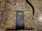 Coach Corner Zip Wristlet In Signature Coated Canvas And Smooth Leather
