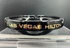 Vintage Las Vegas Hilton Black Glass Ashtray  4 1 2  Dia   Gold Gilt Lettering
