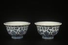 A Pair Of Blue And White Cups