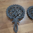 2pc Cast Iron Round Trivet Set W  Handles   Feet  Black  Marked 12