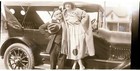 Black   White Negative   Snapshot Man   Woman Standing With Nice Car 