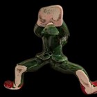 Vintage Green Ceramic Sporty Pixie Elf With Red Boots Laying On Their Belly