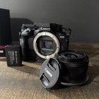 Canon Eos R100 Mirrorless Camera 24 2mp Bundle With Cage  Strap   18-45mm Lens 