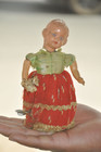 Vintage Baby With Bouquet Celluloid   Iron Wind Up Textured Cloth Toy  Japan