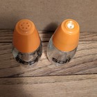 Vintage  Glass Salt   Pepper Shakers Set  Orange Plastic Lids  Text