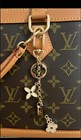 Bag Charm Keychain Featuring Iconic Monogram  And Pearl Motifs 