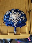 Royal Blue Satin Ribbon Artificial Rose Bridal Bouquet Adorned With A Prominent