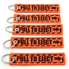 Pull To Eject - Jet Tag Key Chain Neon Orange black Letters 1 Inch X Inches 5