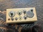 Antique Vintage Brass Scale Weights In A Wooden Block