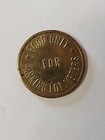 Good Only For Parking Lot Meters courtesy Downtown Retail Assn Brass Token