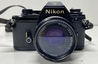 Nikon Em 35mm Slr Camera With 2 Lenses