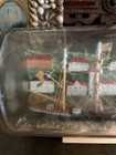 Antique Folk Art Ship In A Bottle With American Flag And Lighthouse Background