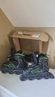   new In Box  Papaison Size Large Adjustable Inline Skates Black green Trim 