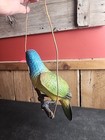 Realistic Perched Parrot Made Out Of Plastic