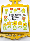 Vintage  cast Iron Trivet Japan Mcm Count But The Pleasant Hours Yellow