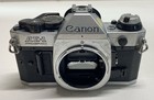 Canon Ae-1 Program 35mm Slr Camera With Lens