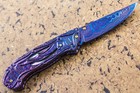 Suchat Jangtanong Custom Folding Knife Color Damascus Carved As Parrot Peridot