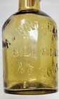 Antique Amber Glass Bottle A j  Wintle   Sons Bill Mills Ross J Turner Dewsbury