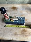 Vintage Cast Iron Lighthouse Sailboat Mechanical Coin Bank Red White Stripes