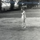 Vintage 1961 Snapshot Photo Woman Watering Grass In Swimsuit Glamour - Z1