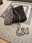 Black Frame Handbag With Silver Chain And Ornate Metal Clasp