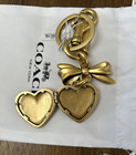 Coach Cz276 Bow Heart Locket Bag Charm-brass ruby
