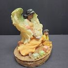 Sitting African American Guardian Angel Figurine With A Baby And A Bear Vintage 