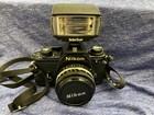 Nikon Em 35mm Slr Film Camera With 50 Mm Lens Kit With Telestar Flash And Manual