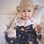 Lifelike Baby Doll Girl  Blonde Wavy Hair Blue Eyes  Light Complexion