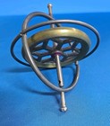 Vintage 1950 s Metal Spinning Gyroscope Toy With Red Center